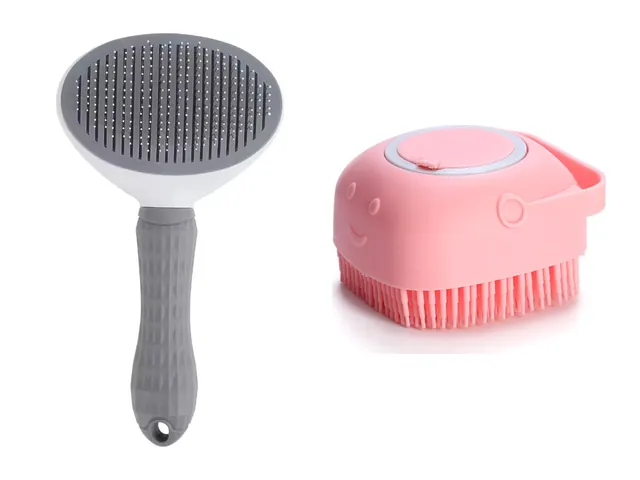 A grey slicker brush with a round bristle head beside a pink silicone bath brush