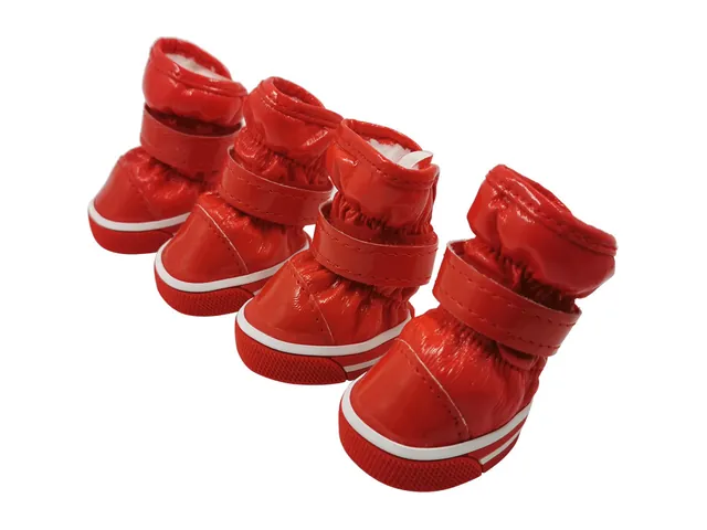 A set of four red padded dog snow boots with hook-and-loop straps